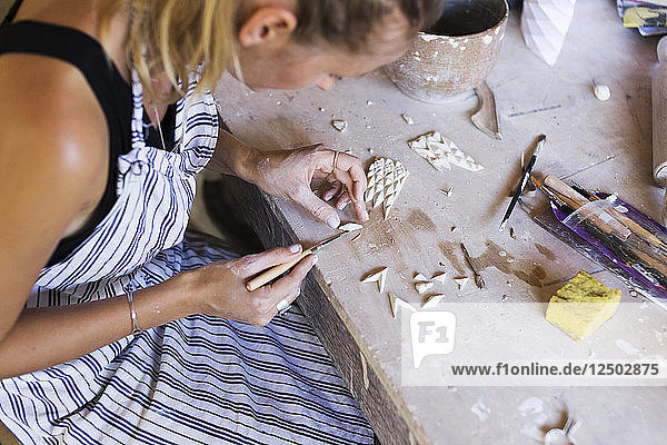 Artistic Woman Working In Ceramic Workshop