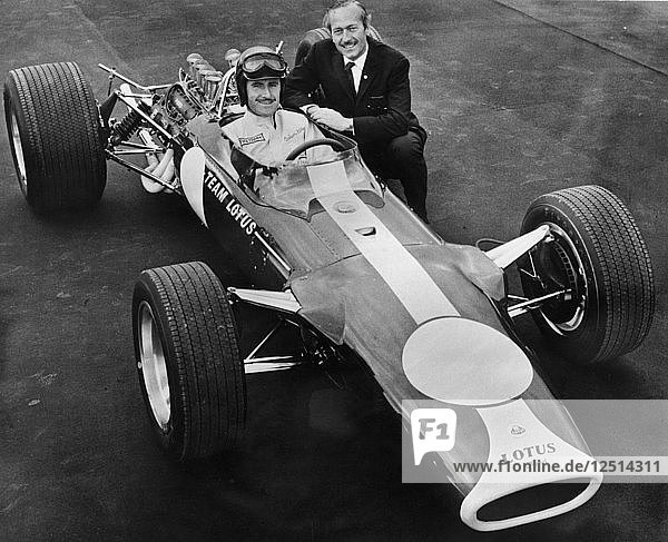 Graham Hill and Colin Chapman with Lotus 49  1967. Artist: Unknown
