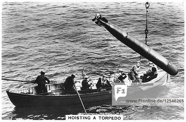 Hoisting a torpedo  HMS Courageous  1937. Artist: Unknown