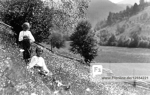 Two girls in a meadow  Bistrita Valley  Moldavia  north-east Romania  c1920-c1945. Artist: Adolph Chevalier