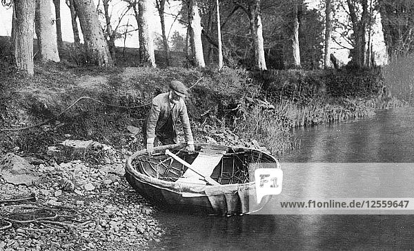 Launching a coracle on the River Boyne  County Meath  Ireland  1924-1926. Artist: WA Green