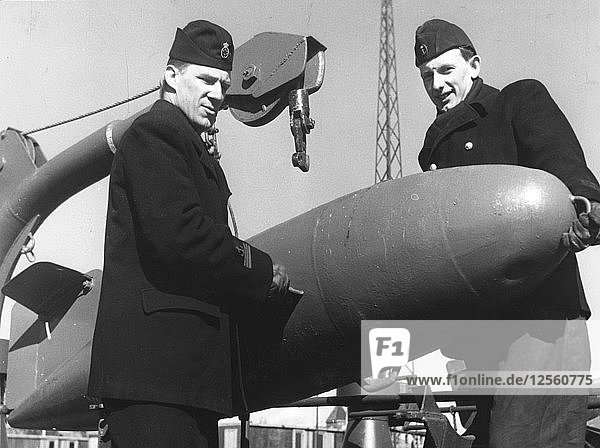 Two sailors with a torpedo  Sweden  1955. Artist: Unknown