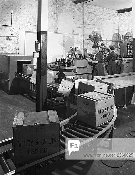 The final stages of bottling whisky at Wiley & Co  Sheffield  South Yorkshire  1960. Artist: Michael Walters