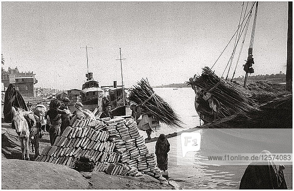 Unloading cargo from a boat  Muhaila  Baghdad  Iraq  1925.Artist: A Kerim