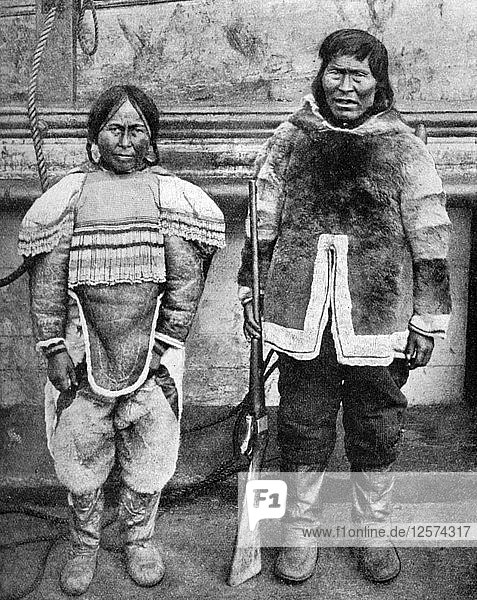 Eskimo hunter and his wife in winter costume  c1922. Artist: Brown Bros