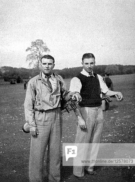 Stanley Matthews and Eddie Hapgood pause between shots during a round of golf  1945. Artist: Unknown