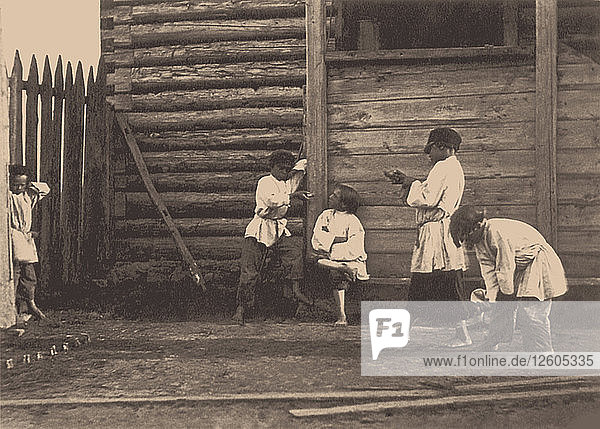 Jungen spielen Knucklebones  1860er Jahre.