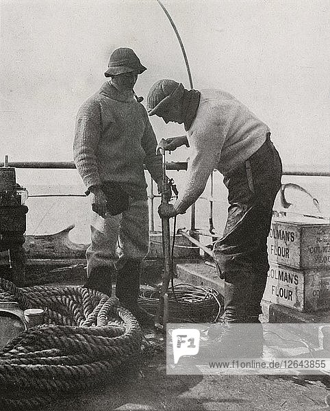 Dr. Wilson and Dr. Atkinson Loading The Harpoon Gun  c1910?1913  (1913). Artist: Herbert Ponting.