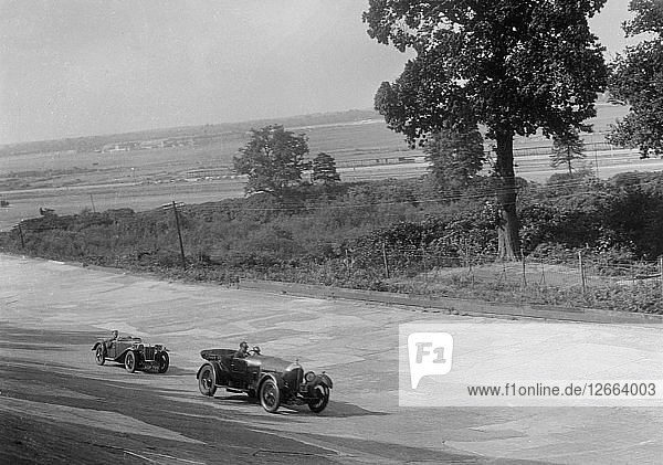 Bentley of FE Elgood and MG Magna of MB Watson racing at a MCC meeting  Brooklands  Surrey  1933. Artist: Bill Brunell.