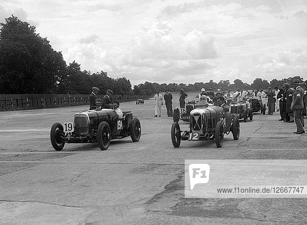 Aston Martins  Salmson and MG at the start of the LCC Relay GP  Brooklands  25 July 1931. Artist: Bill Brunell.
