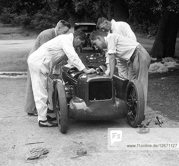 Mechanics working on Leon Cushmans Austin 7 racer for a speed record attempt  Brooklands  1931. Artist: Bill Brunell.