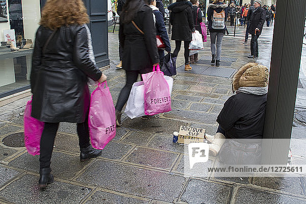 France  Paris  1st district  Rue de Rivoli  a beggar woman  February 2015.