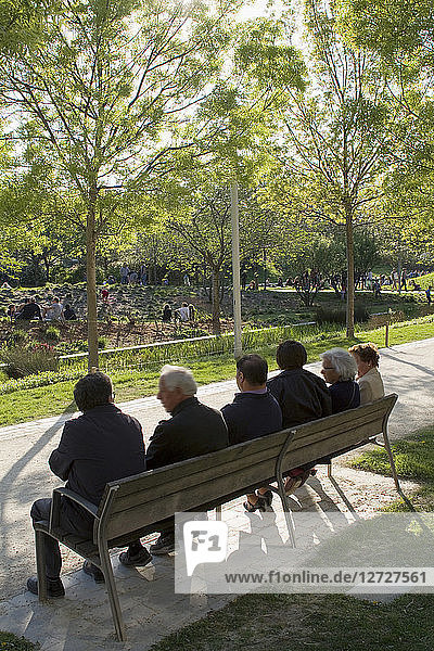 France Paris Parc Clichy-Batignolles-Martin Luther King seniors sitting on a bank back view