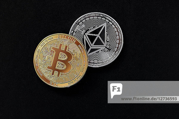 Ethereum and bitcoin on black background