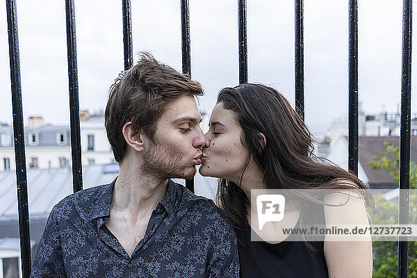 France  Paris  young couple kissing in the district Montmartre