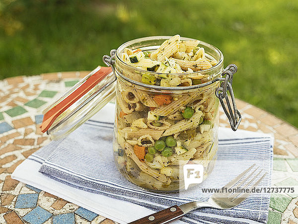 Jar with vegan pasta salad