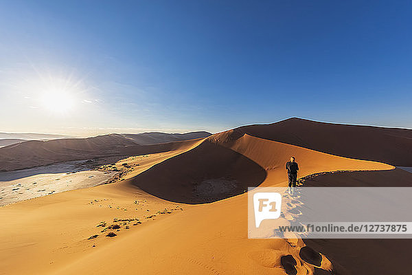 Africa  Namibia  Namib desert  Naukluft National Park  woman on sand dune 'Big Daddy'