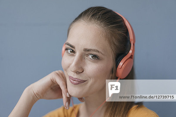 Portrait of a pretty woman  using headphones
