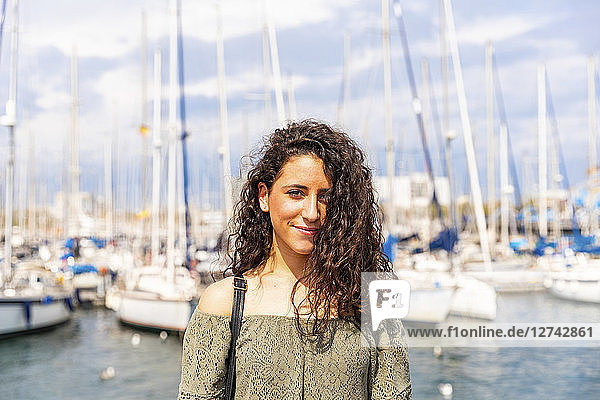 Portrait of smiling teenage girl at a marina