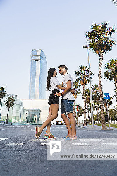 Young couple standing on street  falling in love