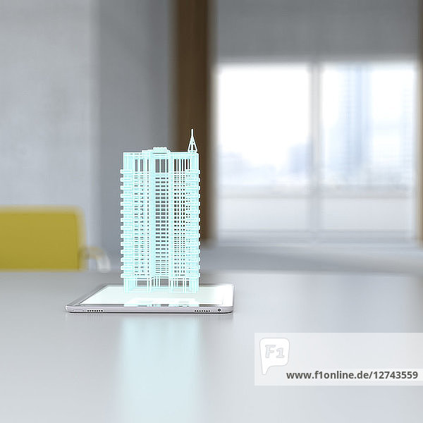 3D rendering  Hologram of building on digital tablet on desk