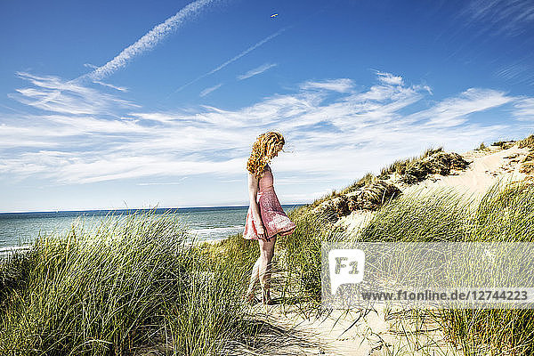 Netherlands  Zandvoort  woman standing in dunes