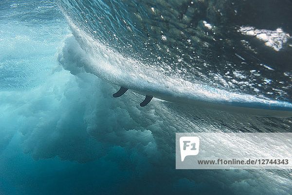 Maledives  Indian Ocean  wave and surfboard  underwater shot