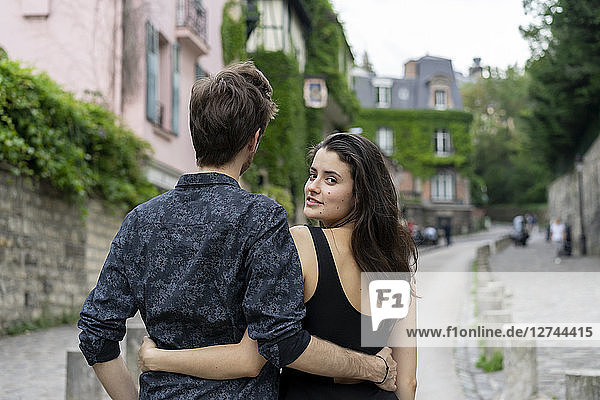 France  Paris  young couple in an alley in the district Montmartre