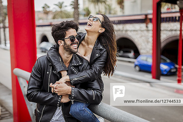 Spain,  Barcelona,  happy young couple in the city