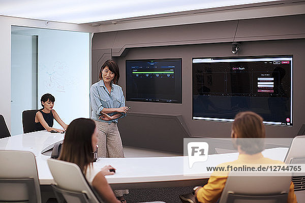 Business people having a meeting in a futuristic office