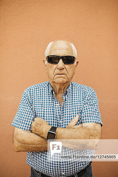 Portrait of senior man wearing sunglasses and smartwatch