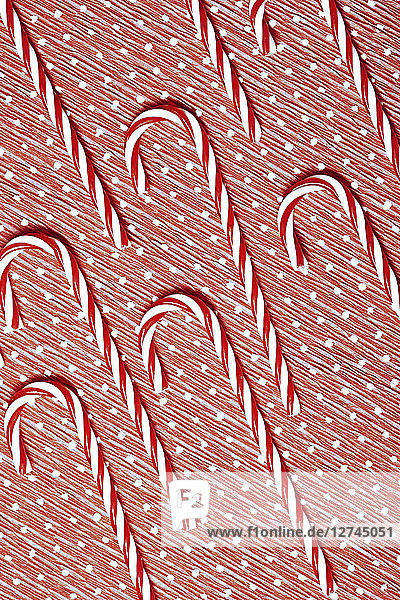 Candy canes on wrapping paper