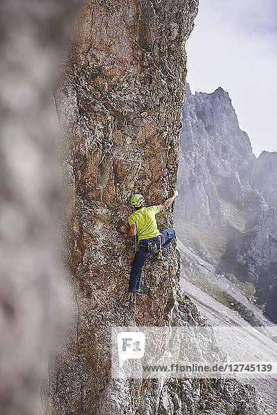 Austria  Innsbruck  Nordkette  man climbing in rock wall