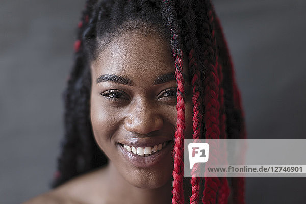 Portrait smiling  confident young woman with red braid