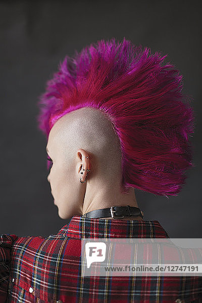 Cool young woman with pink mohawk