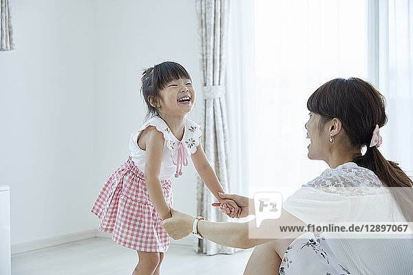 Japanese mother and daughter at home