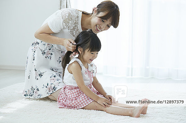 Japanese mother and daughter at home