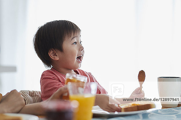Japanese kid having breakfast