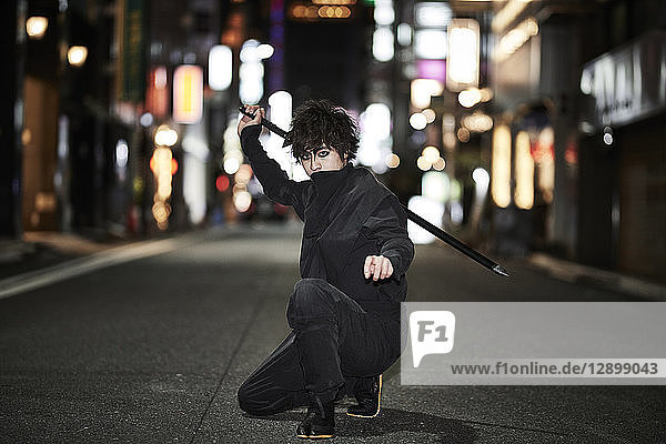 Japanese ninja at night downtown Tokyo