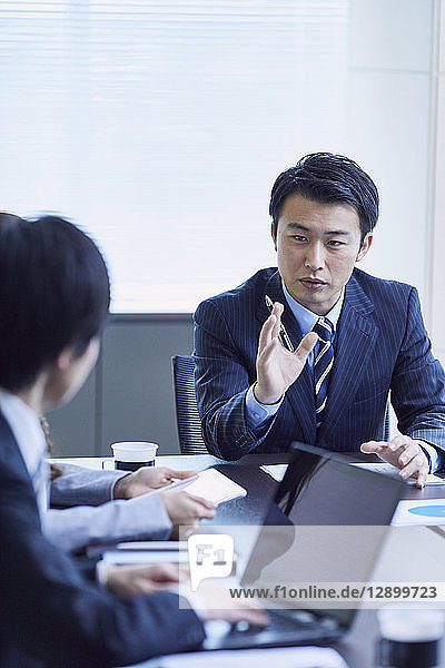 Japanese businesspeople in a meeting