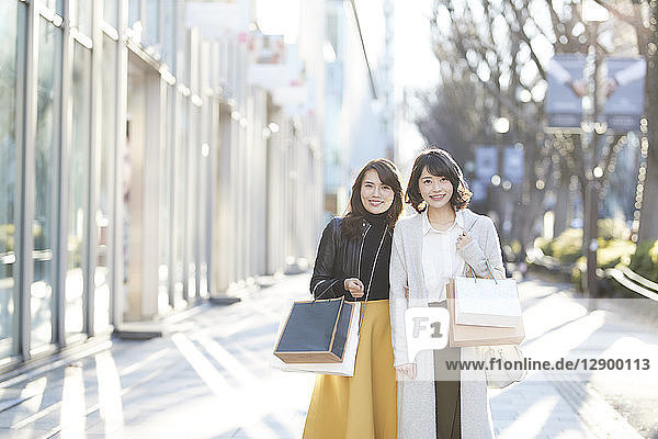 Japanese women window shopping downtown Tokyo
