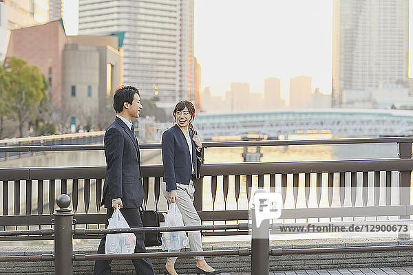 Japanese couple commuting home from work