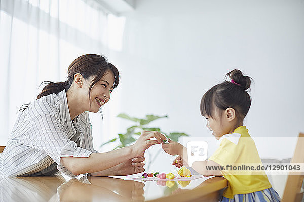 Japanese mother and kid playing