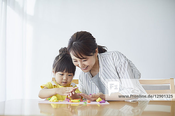 Japanese mother and kid playing