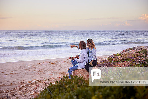 Couple relaxing on beach  Plettenberg Bay  Western Cape  South Africa
