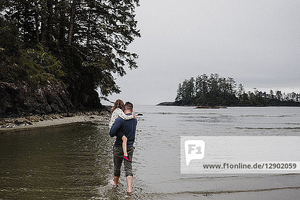 Father and daughter on beach  Tofino  Canada