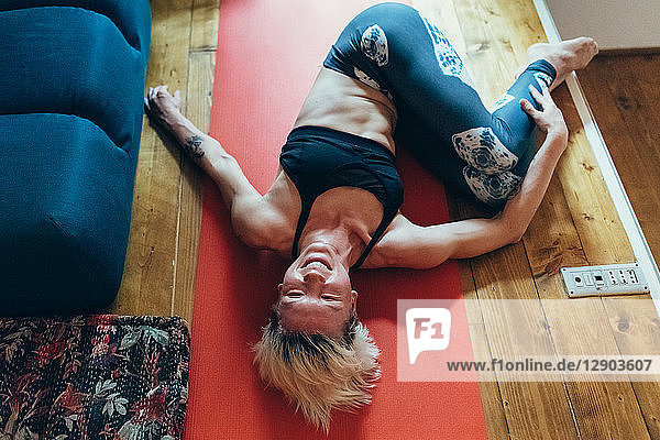 Woman practising yoga at home