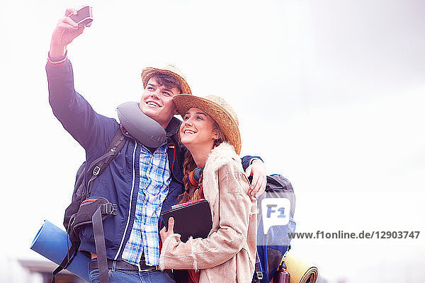 Backpacker couple taking selfie