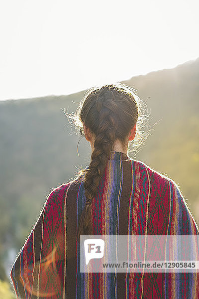 Spain  Alquezar  back view of woman with braid at backlight