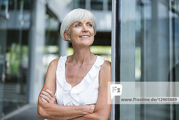 Portrait of smiling senior woman looking sideways